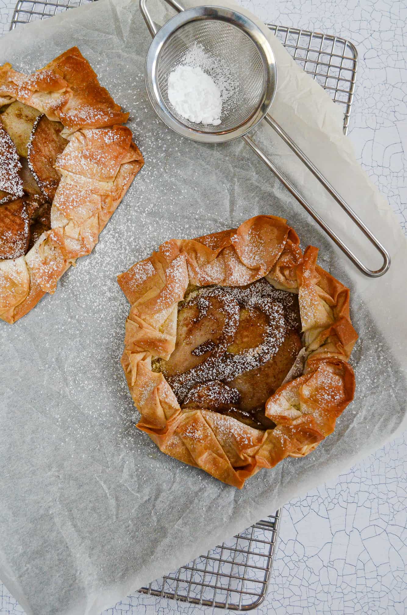 vegan pear and almond filo tarts with icing sugar