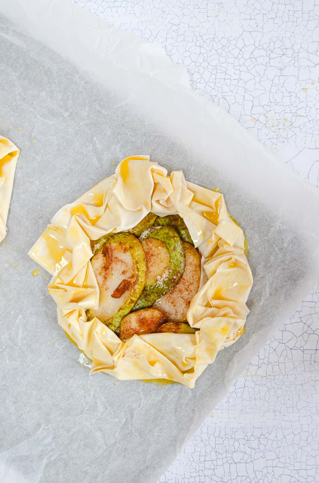 vegan pear and almond filo tart assembled with butter brushed onto filo