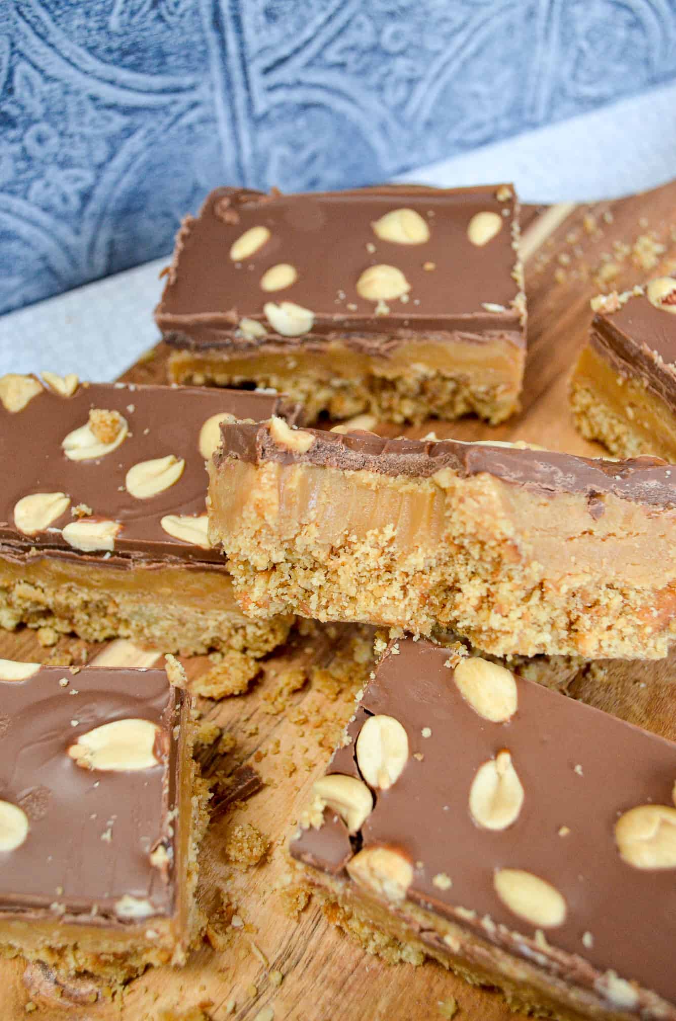 peanut butter caramel biscuit bars with bite taken out