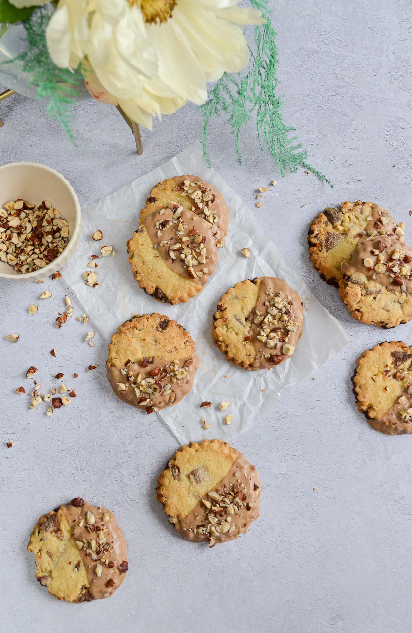 caramelised white chocolate and hazelnut shortbread biscuits on baking paper
