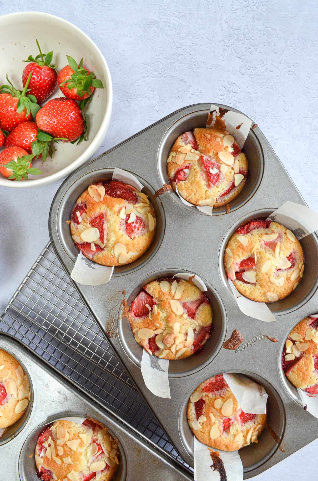 baked strawberry friands in muffin tin